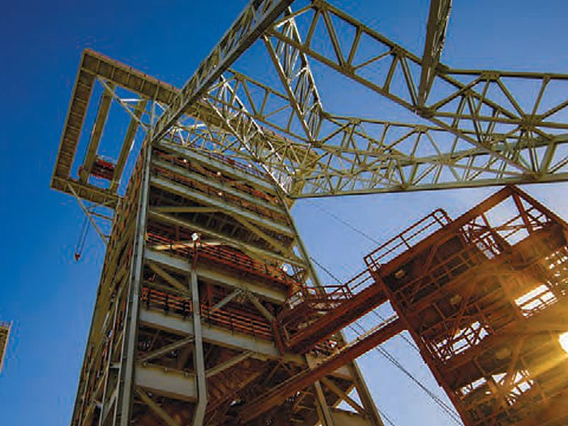 Mine shaft headgear against a blue sky